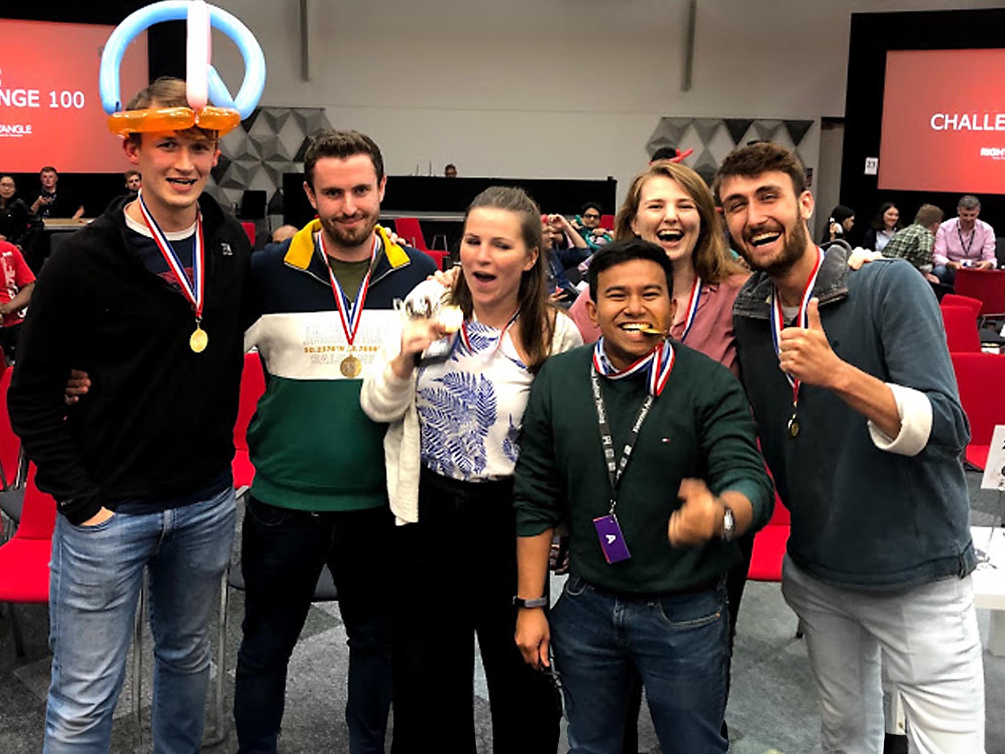 Large group playing fast-paced Challenge 100 team games indoors in Manchester