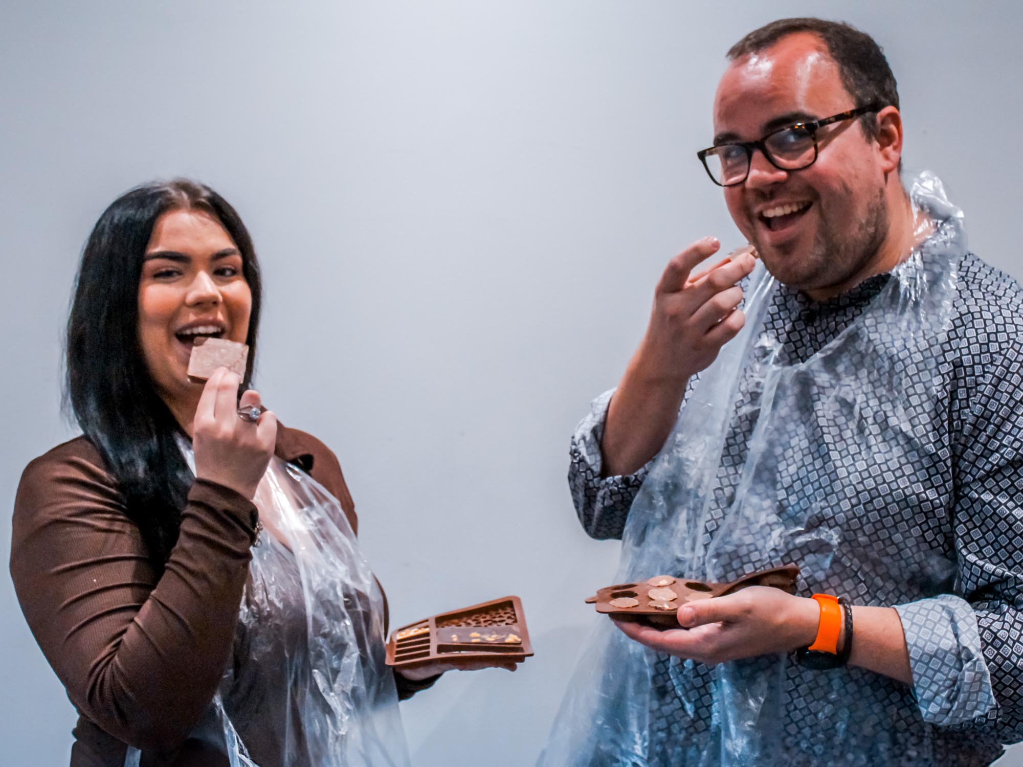 Teams making handmade chocolates at a Christmas party workshop