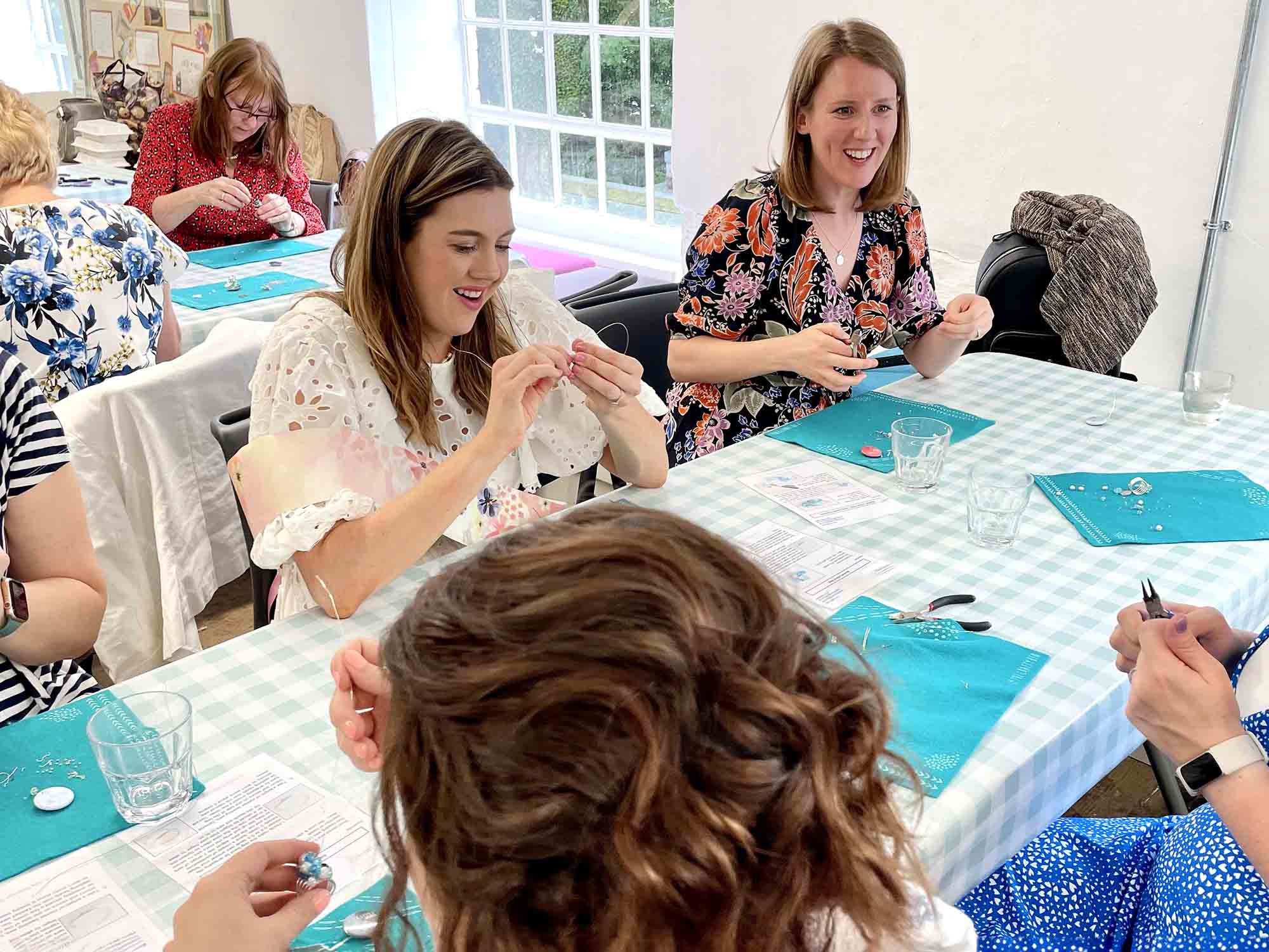 Colleagues making handmade crafts together in a Manchester venue