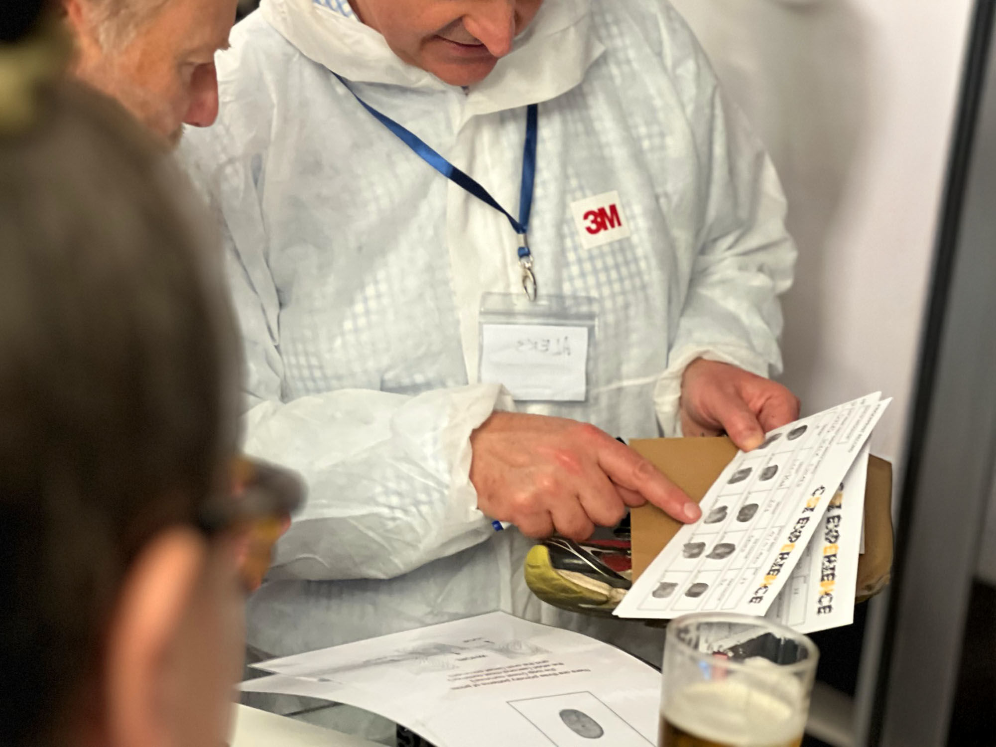 Team taking part in an indoor team building activity in a Liverpool venue, such as cocktail making or chocolate workshop
