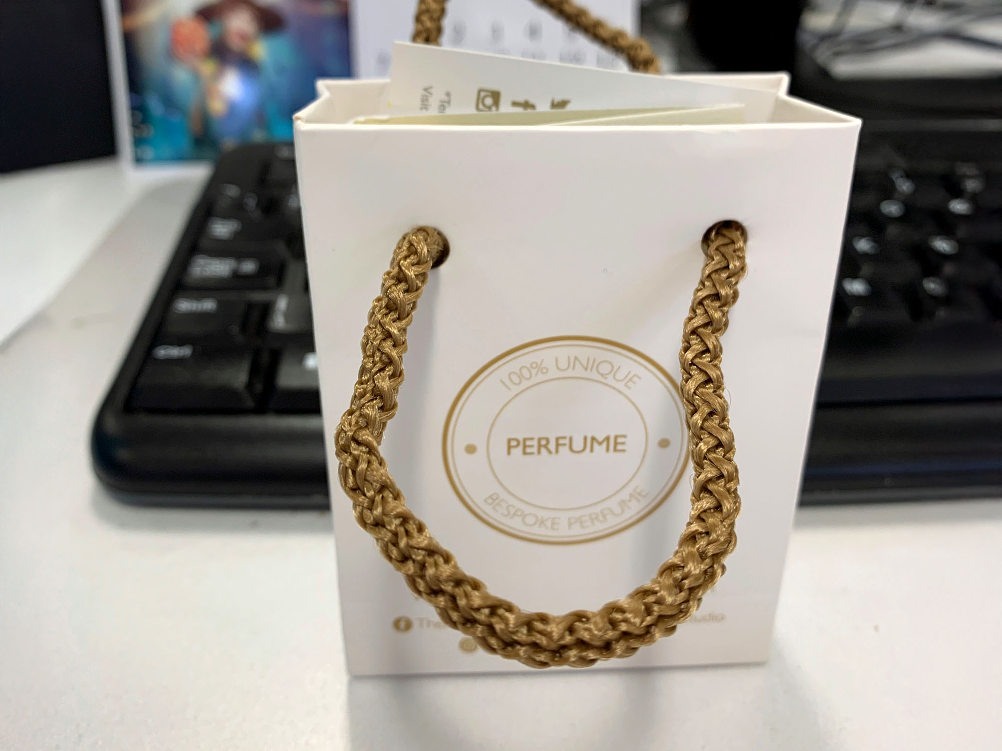 Team creating personalised fragrances at a perfume making class in Manchester