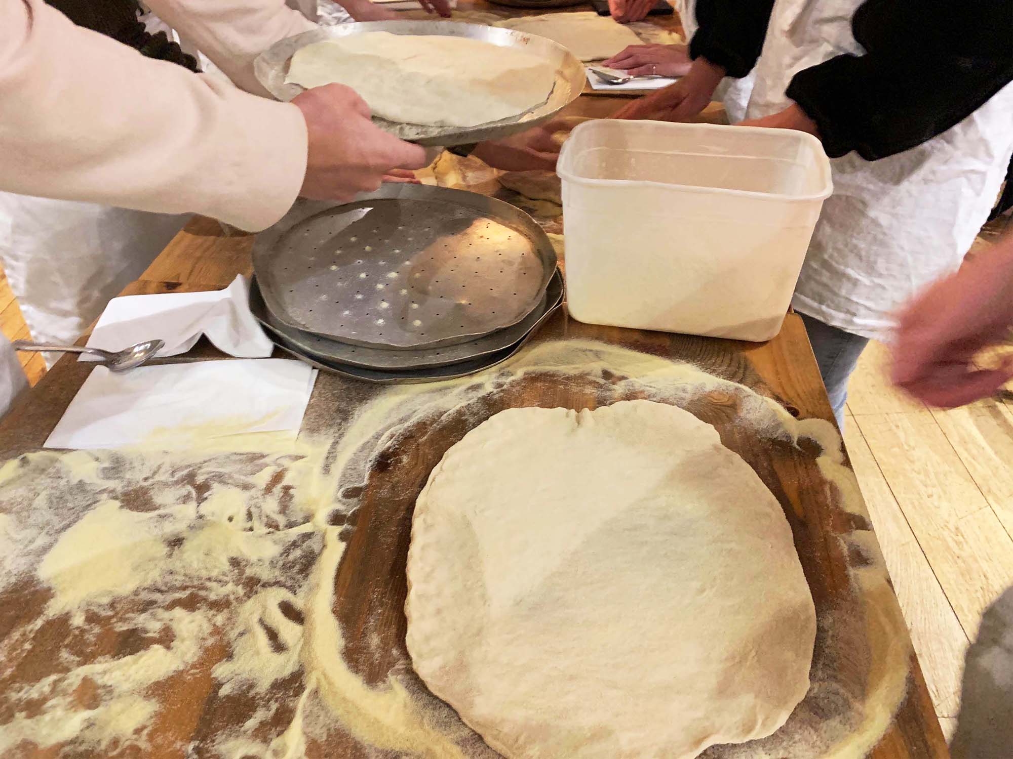 Team building activity with staff making their own pizzas in Manchester