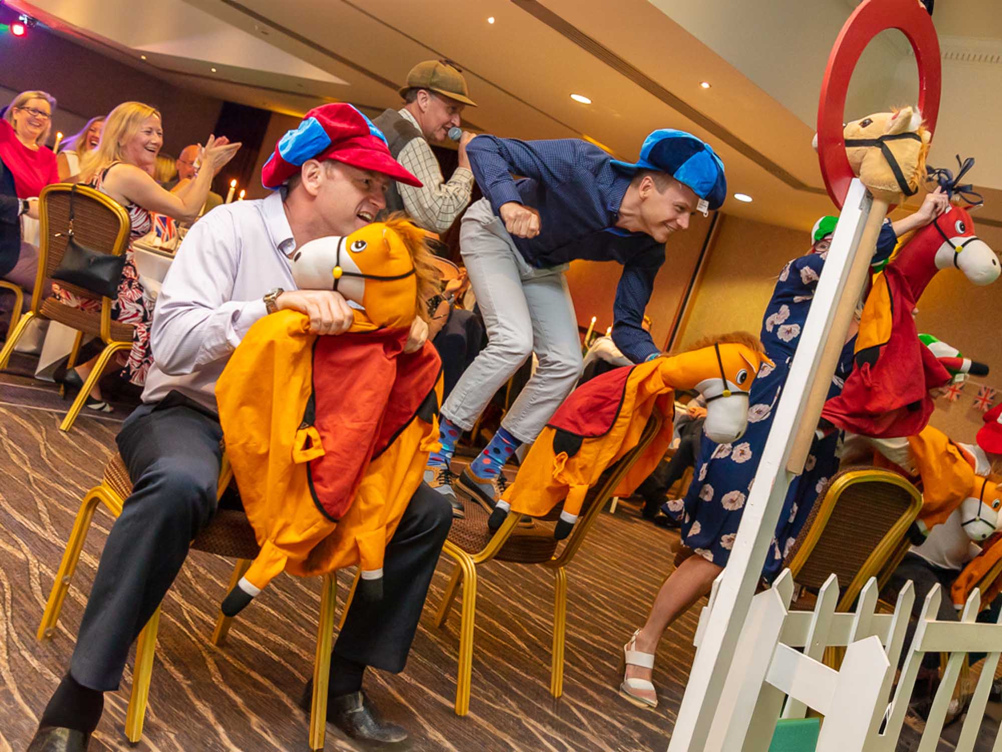 Team enjoying indoor race night entertainment in Manchester